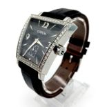 A CORUM PLATINUM LADIES FASHION WATCH WITH DIAMOND BEZEL , BLACK FACE AND SECOND HAND ON A BLACK