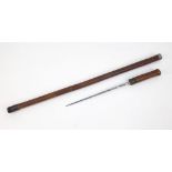 An Antique Victorian Wooden Walking Stick with Hidden Dagger. 88cm total length.