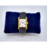 A Must De Cartier Silver Gilded Ladies Quartz Tank Watch. Original leather strap with gilded