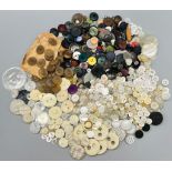 A job lot of vintage buttons. Including mother of pearl, horn, metal and plastic. All sorted into
