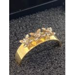 18 carat GOLD and PALLADIUM RING having three diamonds set to top in raised mounts. 2.78 grams. Size