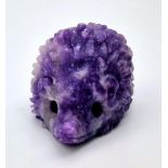 A Hand-Carved Rainbow Flourite Hedgehog Figure. 5 x 2.5cm.