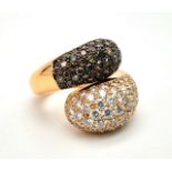 An Impressive 18K Rose Gold Black and White Diamond Twist Ring. Approximately 4ct diamond weight.