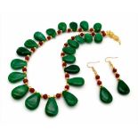 A gorgeous necklace and earrings set with large pear shaped emeralds and multifaceted rubies.