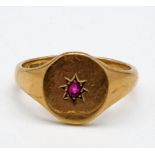 A 9K Yellow Gold Ruby Solitaire Signet Gents Ring. Size V. 6.21g total weight,