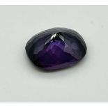 A 23ct Deep Purple Coloured Oval Shaped Gemstone. No certificate so as found