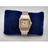 A LADIES GOLD AND STEEL CARTIER WRISTWATCH WITH QUARTZ MOVEMENT. 24mm
