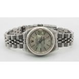 A Rolex Oyster Perpetual Datejust Ladies Watch. Stainless steel strap and case - 26mm. Silver tone