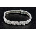 A wonderful 9K white gold bracelet with three rows of diamonds (1.5 carats). Length: 19 cm,