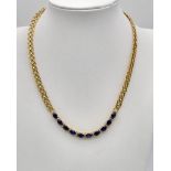 An 18K yellow gold necklace with wonderful oval cut royal blue sapphires and diamonds. Length: 36