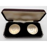 A 1935 and a 1937 George V Silver Crown in a Presentation Case. Please see photos for conditions.