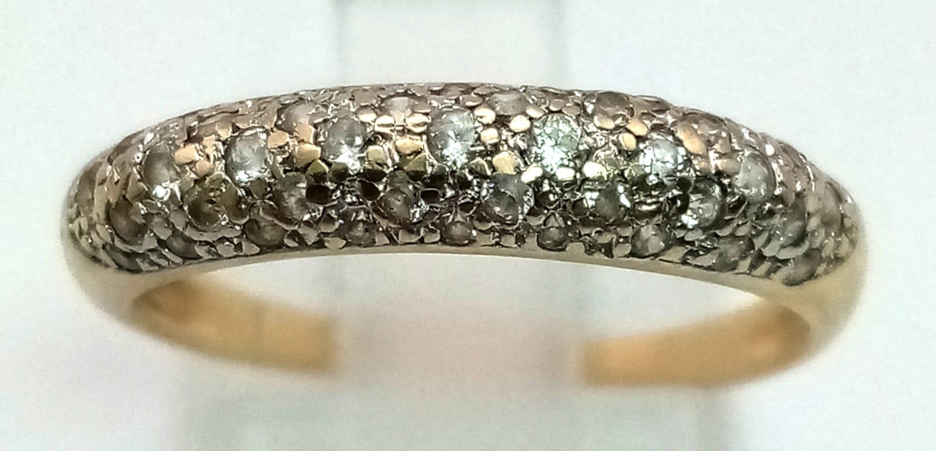 A 9k yellow gold diamond band ring. 0.30ct, 1.8g, size M. - Image 2 of 3