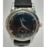 AN OMEGA AUTOMATIC WRIST WATCH, MANUAL MOVEMENT, BLACK FACE AND STRAP. 36mm