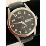 Gentlemans TIMEX T2B941 Quartz wristwatch from the Timex premium Collection, having DAY/DATE