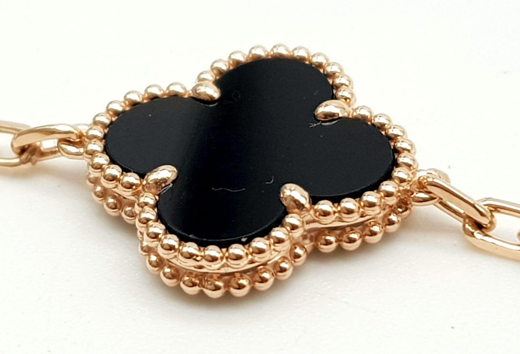 A Van Cleef and Arpels Alhambra bracelet with 5 motifs - 18ct rose gold with black onyx inserts. - Image 3 of 6