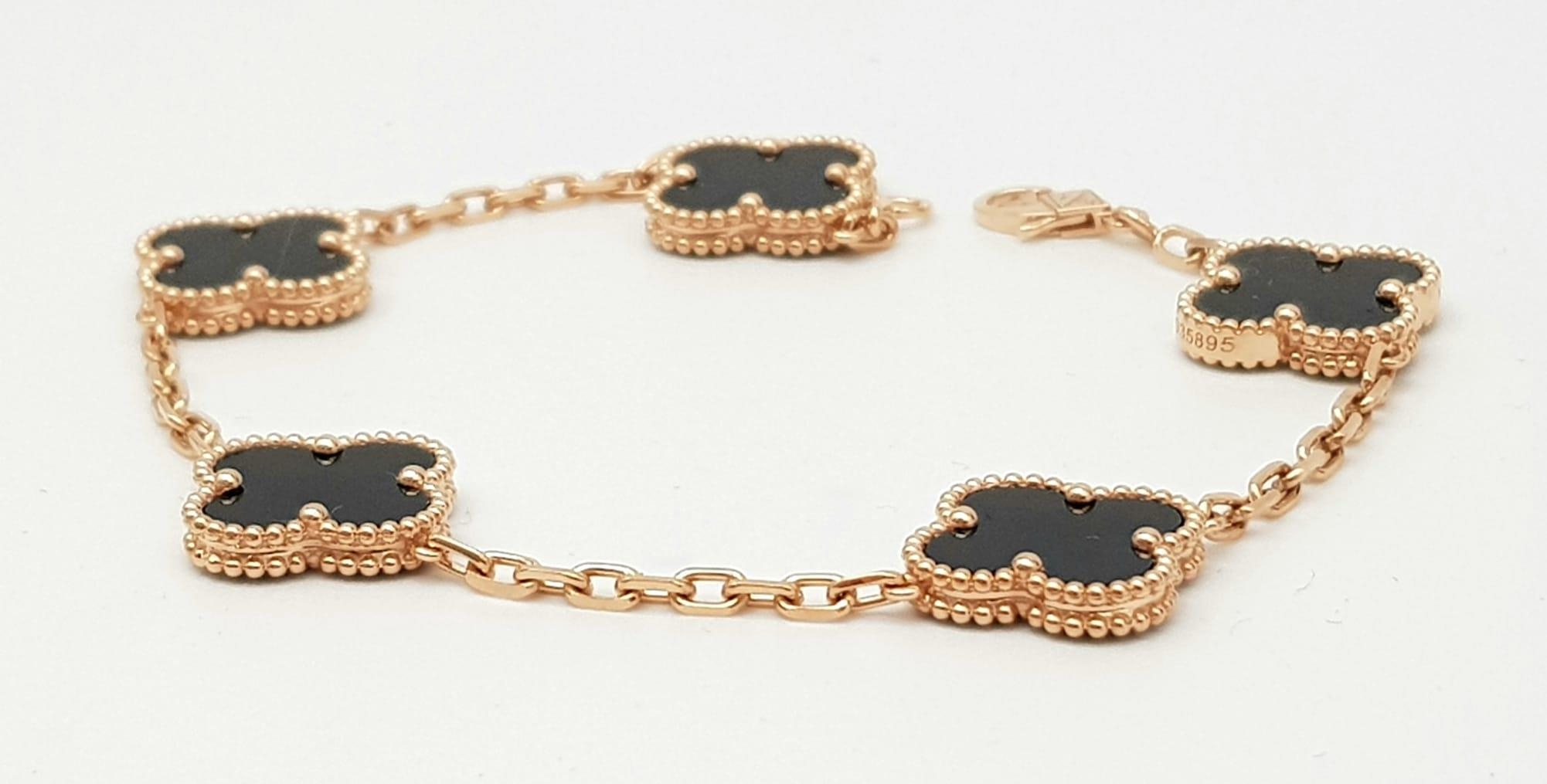 A Van Cleef and Arpels Alhambra bracelet with 5 motifs - 18ct rose gold with black onyx inserts. - Image 2 of 6