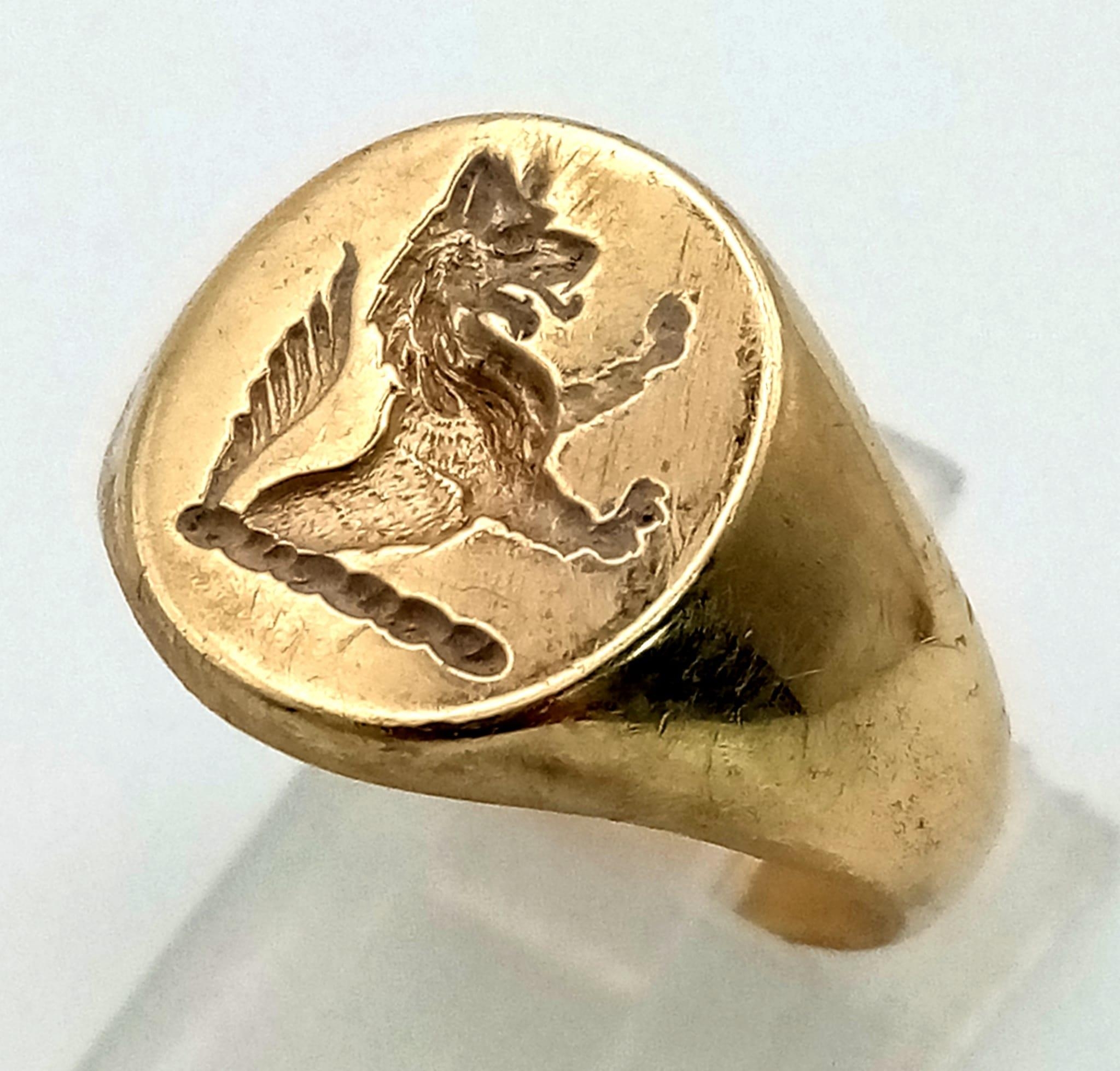 A 9K Yellow Gold Dragon Signet Ring. Size N 1/2. 9g. Ref: 3885.