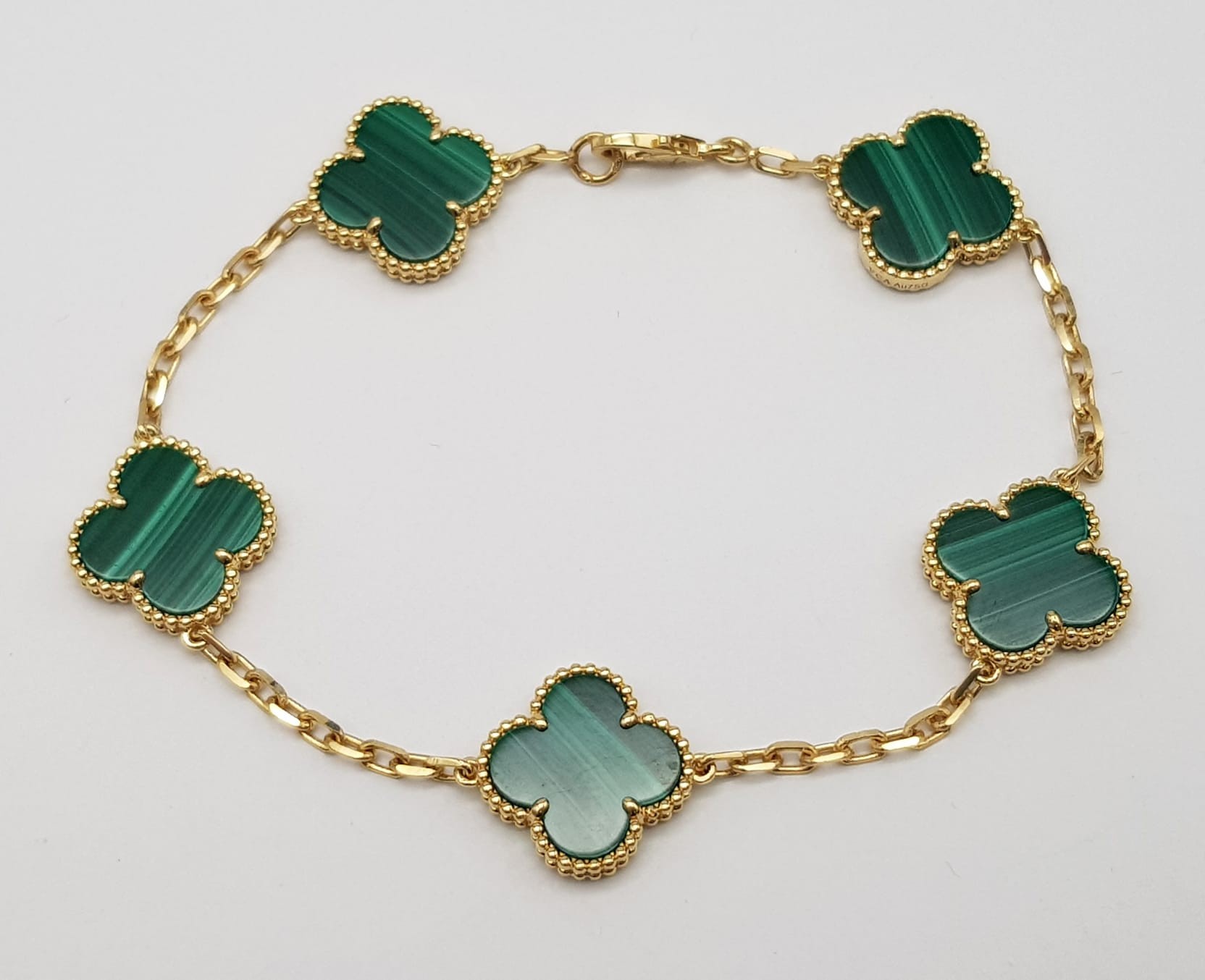 A Van Cleef and Arpels Alhambra bracelet with 5 motifs - 18ct yellow gold with malachite inserts. - Image 7 of 7