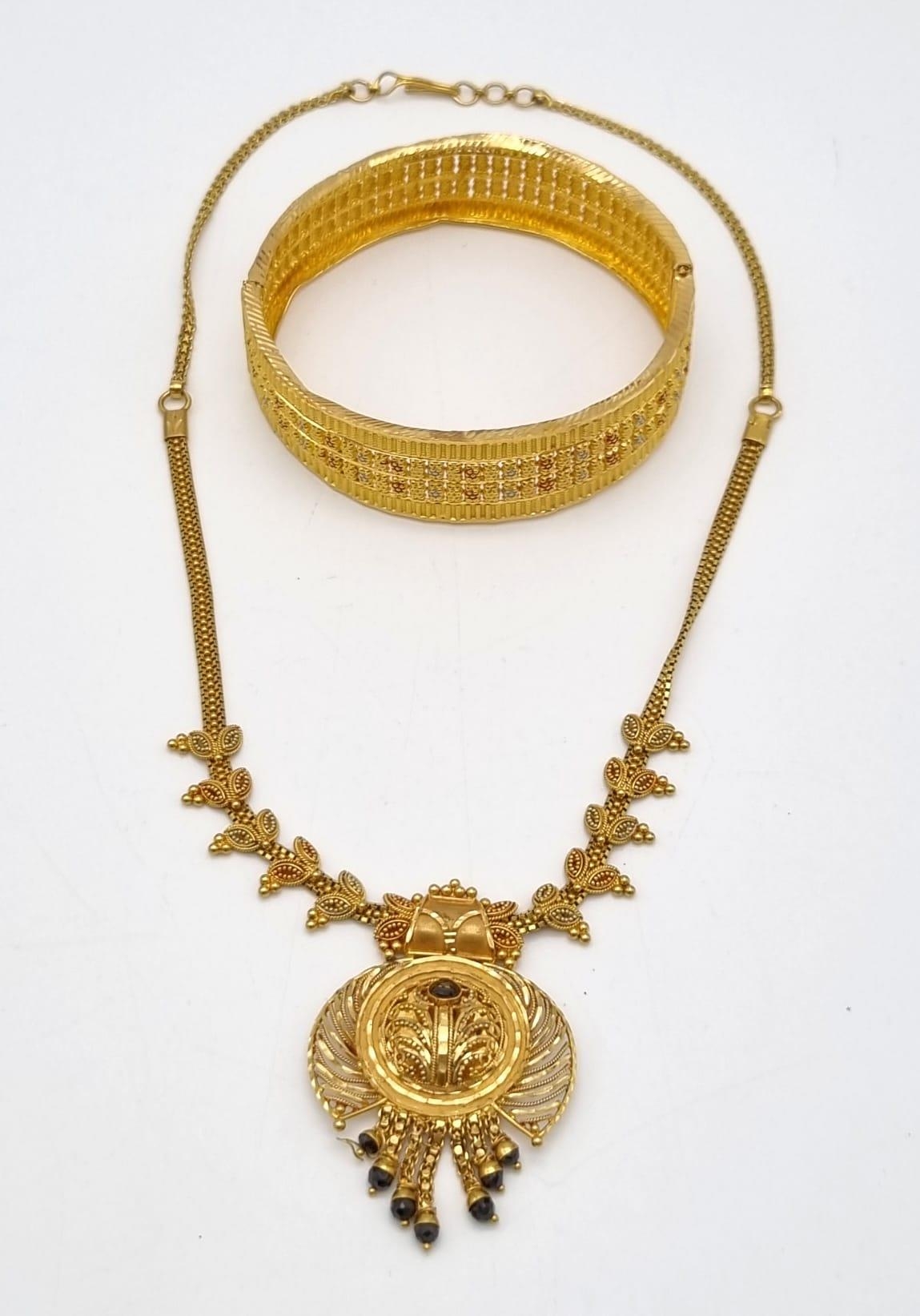 A 22k Yellow Gold Bangle and Necklace. Both slightly have bend/kink damage so A/F. 43.45g total