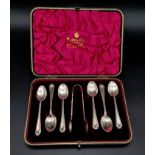 An Antique Mappin and Webb Set of Silver Plated Teaspoons and Sugar Nips. In original box.