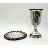 An Antique Silver Kiddush Cup With Plate. Grape decoration. Plate -11cm diameter. Cup 13cm tall.