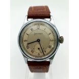 A VINTAGE HELVETIA WRIST WATCH WITH SECOND HAND SUBDIAL AND LEATHER STRAP . FWO 34mm