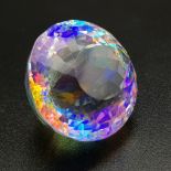A mesmerising, large (68.25 carats), MYSTIC TOPAZ. Round cut, exhibiting beautiful iridescence,
