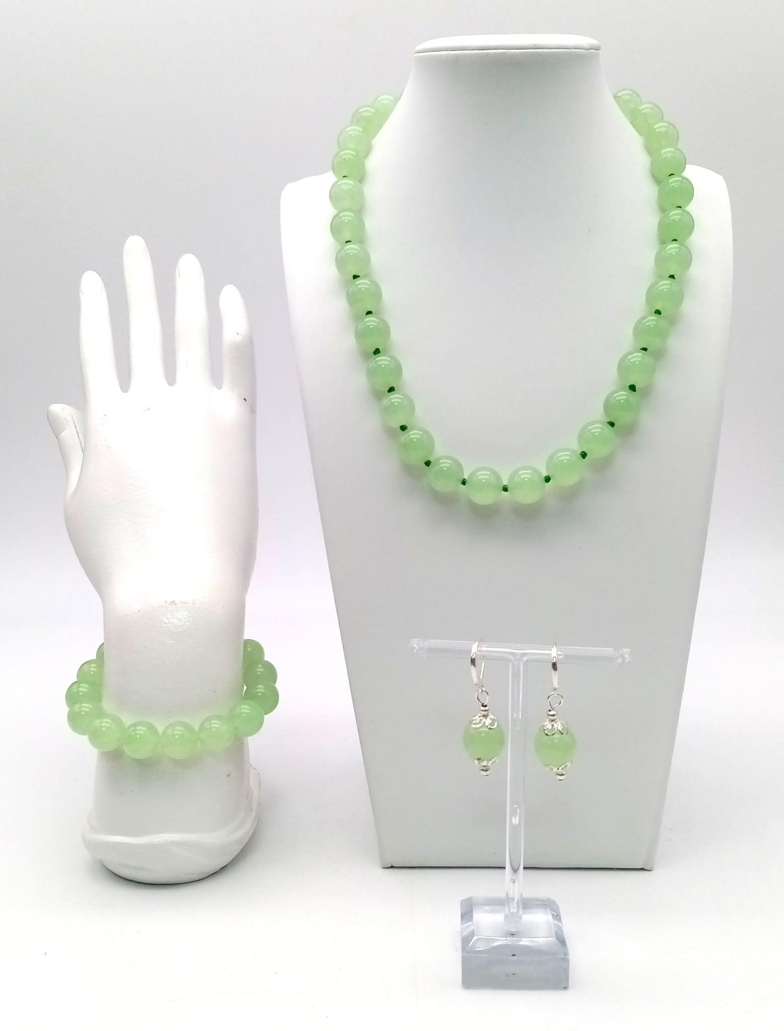 A Light Green Jade Necklace, Bracelet and Earring Set. 12mm beads. 42cm necklace. Expandable
