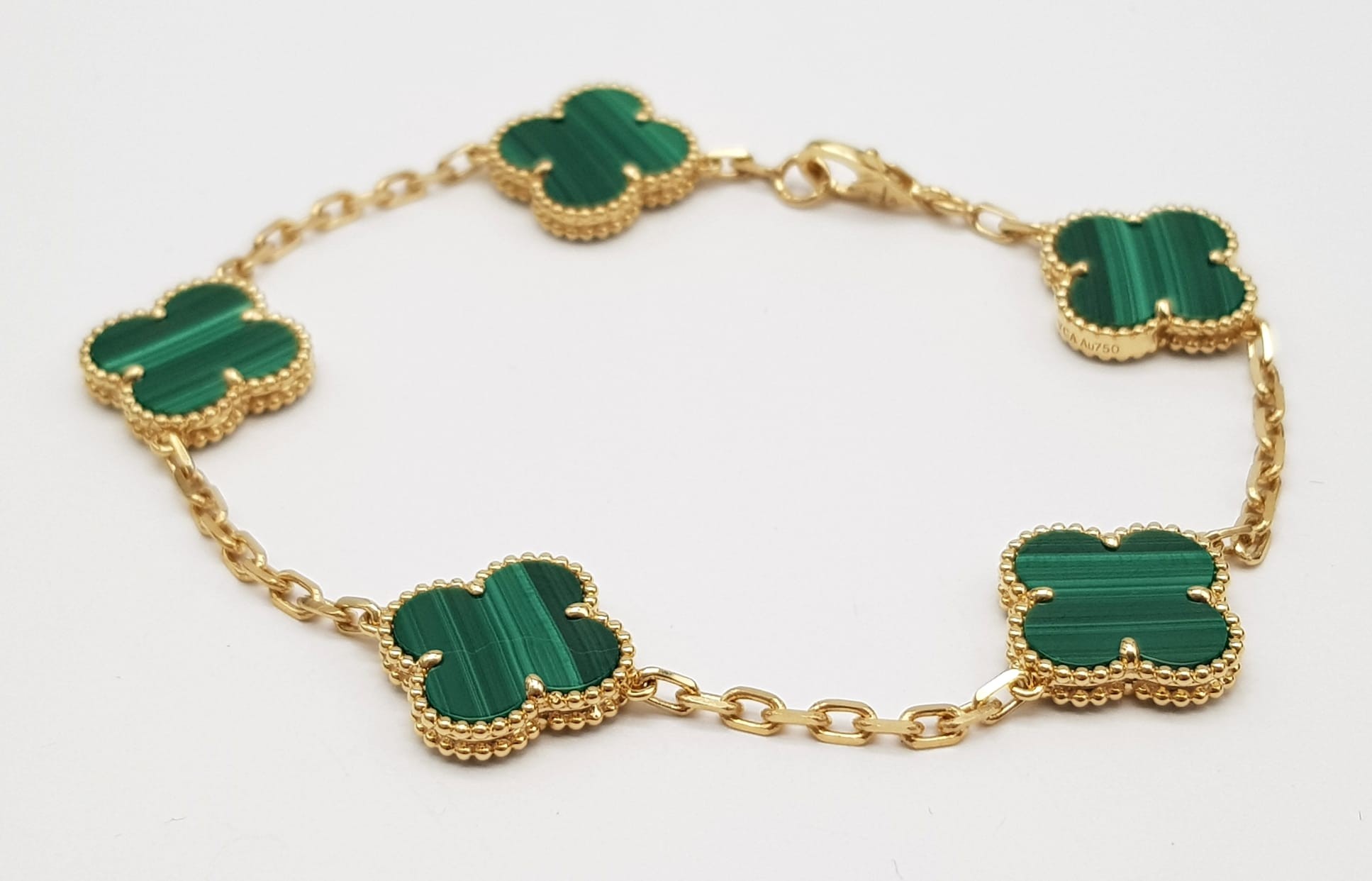 A Van Cleef and Arpels Alhambra bracelet with 5 motifs - 18ct yellow gold with malachite inserts. - Image 2 of 7