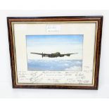 A SIGNED FRAMED PRINT OF THE LANCASTER BOMBER CAPTAINED BY BILL REID V.C. AND TONY IVERSON PLUS