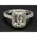 A Boodles Vintage Ashoka-Cut Diamond in Platinum Ring. 1.2ct central diamond with an additional 0.