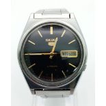 A Vintage Seiko 5 Automatic Gents Watch. Stainless steel strap and case - 36mm. Black dial with
