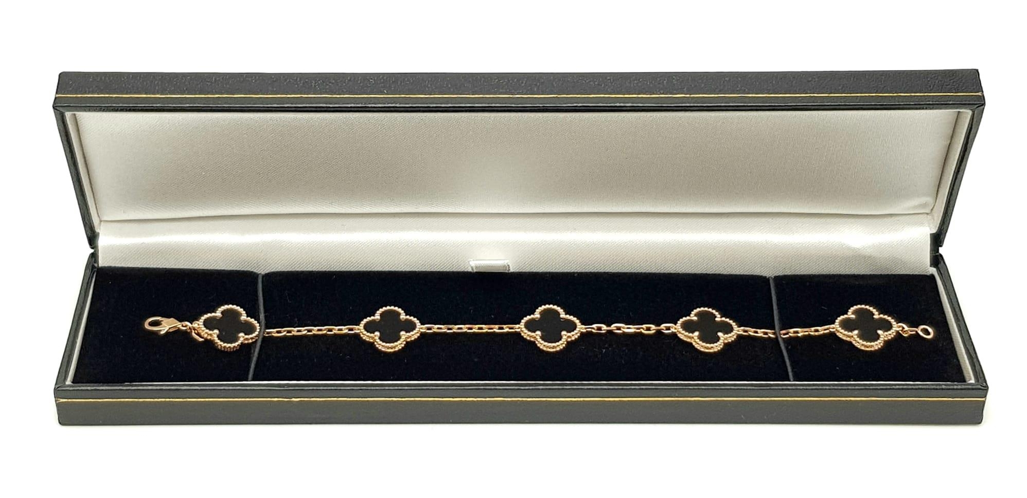 A Van Cleef and Arpels Alhambra bracelet with 5 motifs - 18ct rose gold with black onyx inserts. - Image 4 of 6