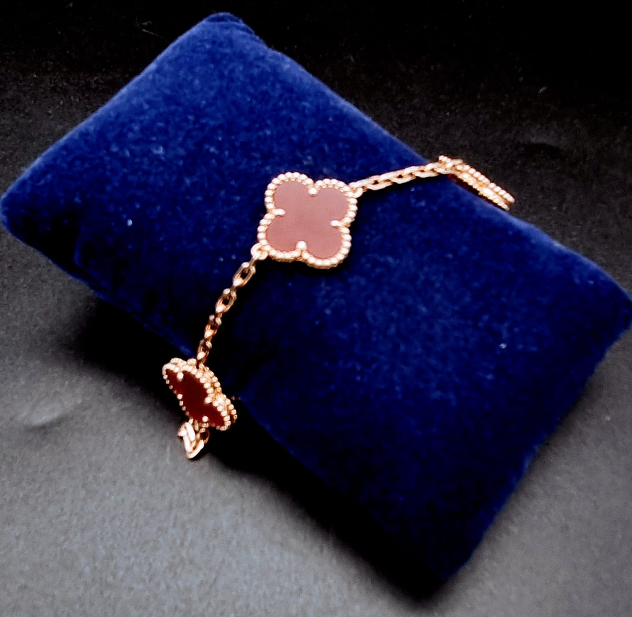 A Van Cleef and Arpels Alhambra bracelet with 5 motifs - 18ct rose gold with cornelian inserts. - Image 5 of 6