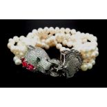 A magnificent, seven row, white pearl, bracelet with an impressive Panther shaped clasp studded with