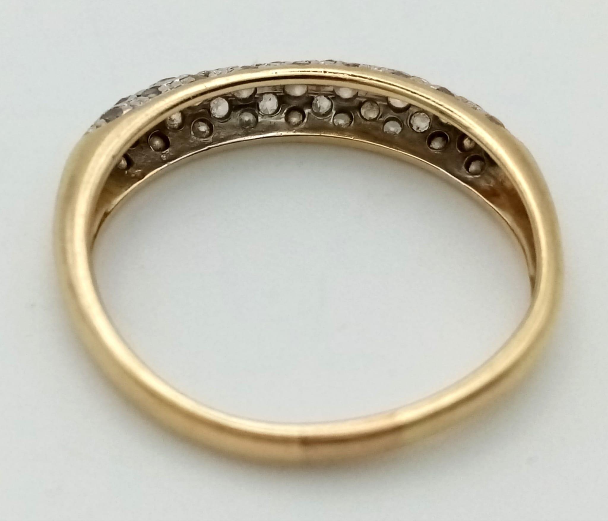 A 9k yellow gold diamond band ring. 0.30ct, 1.8g, size M. - Image 3 of 3