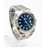 A Rolex Perpetual Oyster Datejust Gents Watch. Metallic blue dial. Automatic movement. Stainless