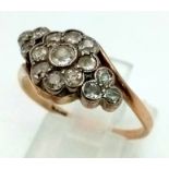 An Antique 15K Rose Gold Diamond Crossover Ring. Central diamond with a halo of diamonds - 1ct.