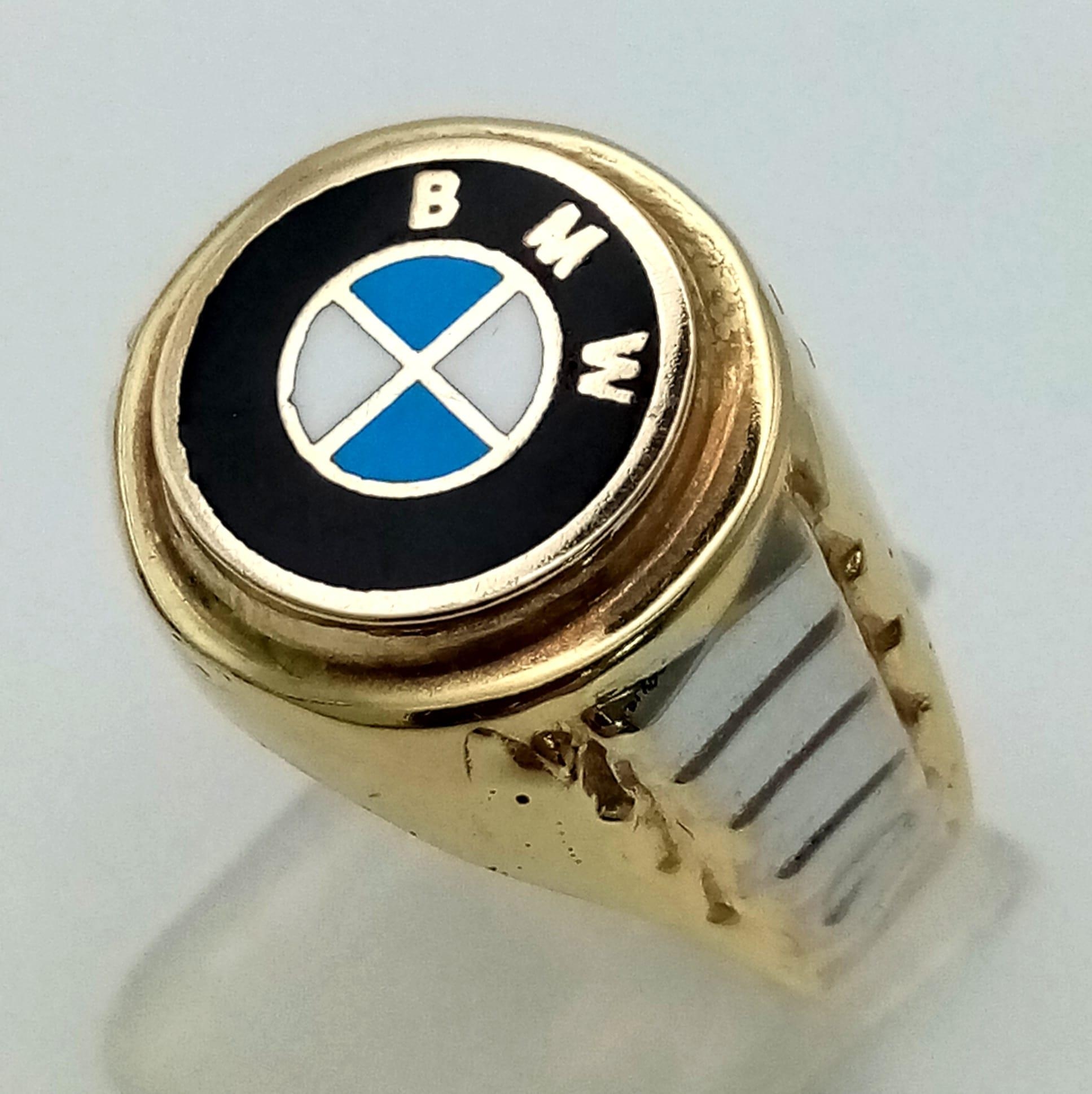 A 14K yellow gold ring with white gold highlights and the BMW logo on top. Ring size: Y, weight:
