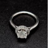 18k white gold halo solitaire ring. Approximately 1ct centre diamond, 3.6g, size M.
