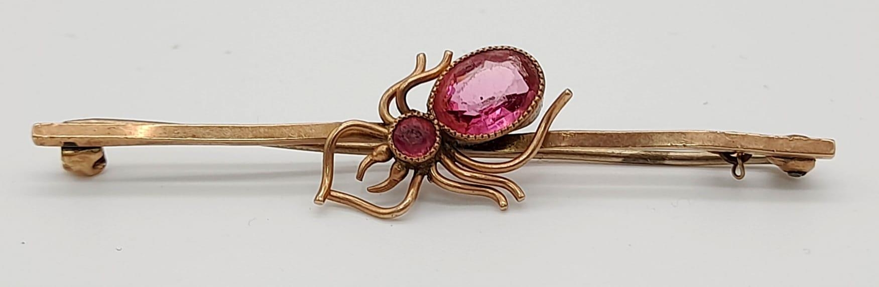 9k rose gold pink stone set spider brooch, 3g in weight.