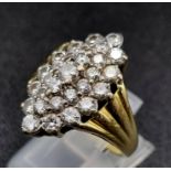 A Browns 18K Yellow and White Gold Diamond Cluster Ring. Twenty-nine brilliant round cut diamonds.