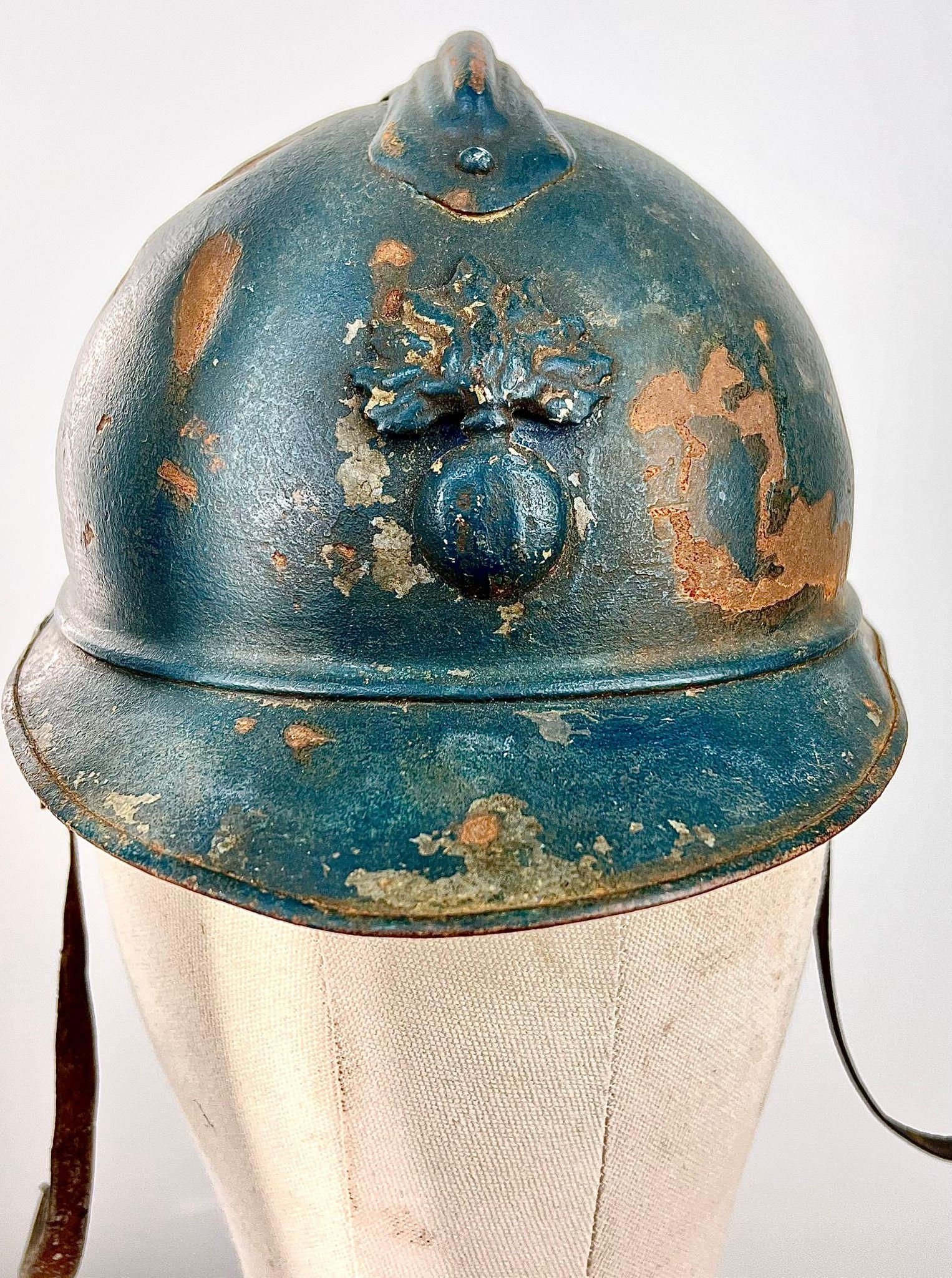 A WW1 French 1915 Mle Casque Adriane Helmet. Badged to the Infantry. Original Paint & Liner.