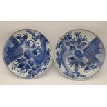 A PAIR OF EARLY JAPANESE IMARI HIGHLY DECORATIVE PLATES WITH SOME SMALL BLEMISHES . 20cms DIAMETER.