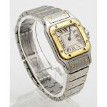 A Cartier Bi-Metal Ladies Watch. Gold and stainless steel strap and case - 25mm. White dial.