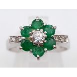 18k white gold diamond and emerald cluster ring. weighs 4.72g size O