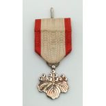 A Japanese Order of The Rising Sun 8th Class Medal with Ribbon. In original presentation case.