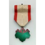 A Japanese Order of The Rising Sun 7th Class Medal with Ribbon. Comes In original presentation case.