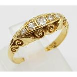 AN 18K GOLD RING WITH 5 DIAMONDS SET IN VINTAGE STYLE SETTING. 4.4gms size N