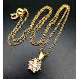 18K YELLOW GOLD DIAMOND FLOWER CLUSTER PENDANT AND CHAIN. 0.22CT DIAMOND WEIGHS 3.28G